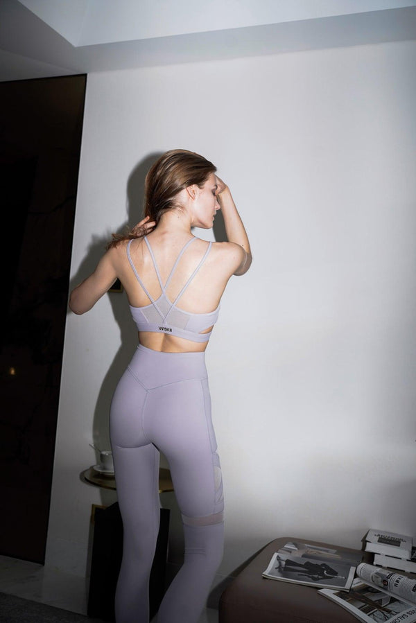 Model wears a WISKII training mesh leggings